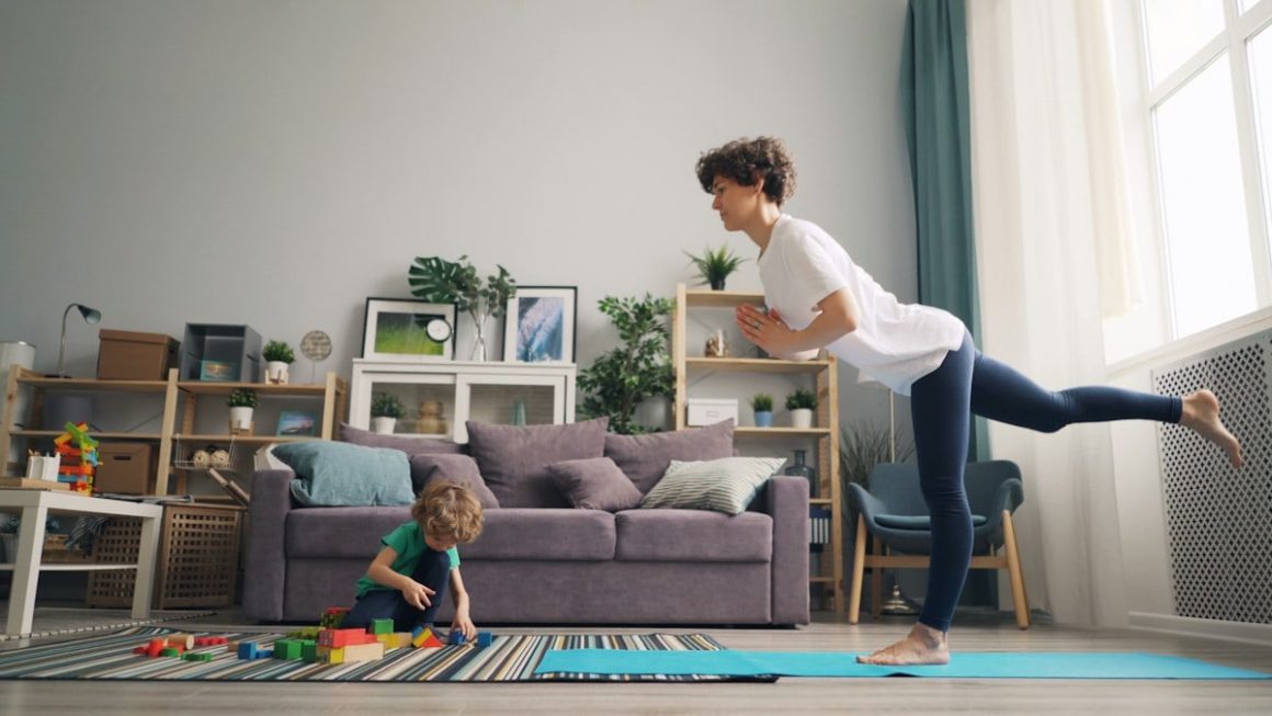 a woman and a child playing in a living room